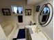 A well-lit bathroom with a vanity, toilet, and a soaking tub at 611 E Fairway Rd, Henderson, NV 89015