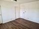 Bedroom featuring new floors, closet, and fresh paint at 611 E Fairway Rd, Henderson, NV 89015