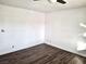 Bright bedroom featuring hardwood floors, neutral walls, and ample natural light at 611 E Fairway Rd, Henderson, NV 89015