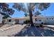 Charming single-story home featuring a xeriscaped yard, covered entrance, and a two car garage at 611 E Fairway Rd, Henderson, NV 89015