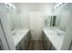 Dual sink bathroom with modern fixtures and grey cabinets at 5713 Heineken Dr, North Las Vegas, NV 89031
