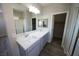 Bright bathroom featuring double sinks, separate shower and soaking tub, and wood-look flooring at 5713 Heineken Dr, North Las Vegas, NV 89031