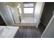 Bright bathroom featuring a tub and separate shower with modern fixtures at 5713 Heineken Dr, North Las Vegas, NV 89031