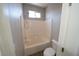Bathroom with tiled shower-tub and modern toilet at 5713 Heineken Dr, North Las Vegas, NV 89031