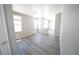 Spacious bedroom features multiple windows and neutral walls at 5713 Heineken Dr, North Las Vegas, NV 89031