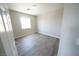 Bright bedroom featuring hard surface floors, a neutral color palette, and natural light at 5713 Heineken Dr, North Las Vegas, NV 89031