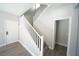 Entryway with natural light, white railings, and access to an adjacent room and second story at 5713 Heineken Dr, North Las Vegas, NV 89031