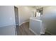 Hallway featuring modern flooring, neutral paint, and access to multiple rooms at 5713 Heineken Dr, North Las Vegas, NV 89031