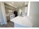 Contemporary kitchen featuring quartz countertops, stainless steel sink, and ample cabinet space at 5713 Heineken Dr, North Las Vegas, NV 89031