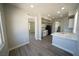 Modern kitchen with stainless steel appliances, light gray cabinets, and open layout at 5713 Heineken Dr, North Las Vegas, NV 89031
