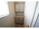 Upstairs laundry room featuring built in storage cabinets, wood-look floors and natural light at 5713 Heineken Dr, North Las Vegas, NV 89031