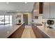 Modern kitchen with island, stainless steel appliances, and stylish backsplash at 1469 Dragon Stone Pl, Henderson, NV 89012