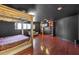 Main bedroom with a four-poster bed, sitting area, and built-in shelving at 1420 S 8Th St, Las Vegas, NV 89104