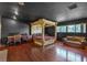 Large bedroom with a stately four-poster bed and hardwood floors at 1420 S 8Th St, Las Vegas, NV 89104