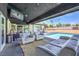 Relaxing poolside patio with seating and TV at 1420 S 8Th St, Las Vegas, NV 89104