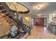 Impressive entry with a circular wrought-iron staircase and stone feature wall at 1420 S 8Th St, Las Vegas, NV 89104