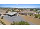 Aerial view of house, RV cover, and surrounding area at 2851 S Winchester Ave, Pahrump, NV 89048