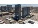 Wide aerial view of a modern high rise building with a mix of urban and suburban landscape under a bright blue sky at 4471 Dean Martin Dr # 2205, Las Vegas, NV 89103