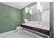Modern bathroom with double sinks, marble countertops, stylish lighting, and tile flooring at 4471 Dean Martin Dr # 2205, Las Vegas, NV 89103