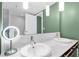 Modern bathroom with double sinks, marble countertops, stylish lighting, and tile flooring at 4471 Dean Martin Dr # 2205, Las Vegas, NV 89103