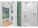Bathroom with tiled shower and a stacked washer and dryer next to the entrance at 4471 Dean Martin Dr # 2205, Las Vegas, NV 89103