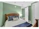 Comfortable bedroom featuring a bed with decorative pillows and view of the ensuite bath at 4471 Dean Martin Dr # 2205, Las Vegas, NV 89103