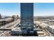 Towering high-rise building with modern design, reflecting the urban skyline and architecture at 4471 Dean Martin Dr # 2205, Las Vegas, NV 89103