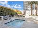 Inviting hot tub with seating area, lounge chairs, and landscaping offering a relaxing outdoor experience at 4471 Dean Martin Dr # 2205, Las Vegas, NV 89103
