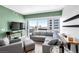 Inviting living room featuring a comfortable sectional sofa, modern decor, and large windows offering panoramic city views at 4471 Dean Martin Dr # 2205, Las Vegas, NV 89103