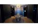Elegant lobby featuring decorative wallpaper, a modern chandelier, and a stylish round table at 4471 Dean Martin Dr # 2205, Las Vegas, NV 89103