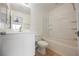 Well-lit bathroom featuring a vanity, toilet, and a shower-tub combination at 1161 Gecko Rd, Henderson, NV 89002