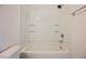 A bathtub and shower with shelving at 1161 Gecko Rd, Henderson, NV 89002
