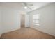 An empty bedroom with a ceiling fan, a closet, and a window at 1161 Gecko Rd, Henderson, NV 89002