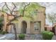 Charming two-story home featuring desert landscaping, a tile roof, and an attached garage at 1161 Gecko Rd, Henderson, NV 89002