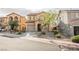 Charming two-story home featuring desert landscaping, a tile roof, and an attached garage at 1161 Gecko Rd, Henderson, NV 89002
