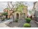 Charming two-story home featuring desert landscaping, a tile roof, and an attached garage at 1161 Gecko Rd, Henderson, NV 89002