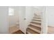 Hallway view of stairs and a half-bath with tiled floor at 1161 Gecko Rd, Henderson, NV 89002