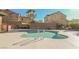 Beautiful, sparkling community pool with access stairs, surrounded by well-maintained residences at 1161 Gecko Rd, Henderson, NV 89002