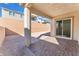 Covered patio with brick pavers and a spacious grassy area at 8965 Coastal Oaks St, Las Vegas, NV 89166