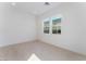 Bright bedroom with large windows and tile floors at 8965 Coastal Oaks St, Las Vegas, NV 89166