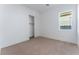 Well-lit bedroom featuring a closet and carpet at 8965 Coastal Oaks St, Las Vegas, NV 89166