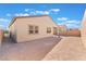 Tan house with covered patio and grassy backyard at 8965 Coastal Oaks St, Las Vegas, NV 89166