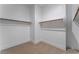 Spacious walk-in closet with double hanging rods at 8965 Coastal Oaks St, Las Vegas, NV 89166