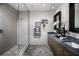 Spa-like bathroom with double sinks, a large shower, and herringbone tile at 9031 Coastal Oaks St, Las Vegas, NV 89166