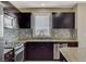 Kitchen with stainless steel appliances and mountain views at 8255 S Las Vegas Blvd # 1521, Las Vegas, NV 89123