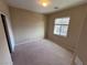 Neutral bedroom with carpet flooring, a window with blinds, and a closet at 7421 Old Compton St, Las Vegas, NV 89166