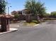 Gated community entrance with brick pillars and well-maintained landscaping at 7421 Old Compton St, Las Vegas, NV 89166