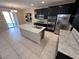 Open concept kitchen with stainless steel appliances and granite countertops at 7421 Old Compton St, Las Vegas, NV 89166