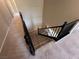 Carpeted staircase with black decorative railings at 7421 Old Compton St, Las Vegas, NV 89166