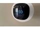 Smart thermostat on a wall, displaying settings for temperature control and home automation at 7421 Old Compton St, Las Vegas, NV 89166